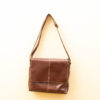 Timeless brown leather messenger bag for versatile style and functionality in any setting.