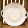 Elegant porcelain serving dish with blue accents, perfect for any dining occasion.