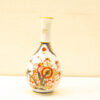 Elegant porcelain vase with vibrant floral patterns and gold accents, perfect for any decor.
