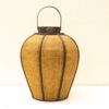 Woven lantern with metal accents, perfect for adding warmth and charm to any space.