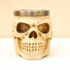Unique bone-like skull mug with detailed design and stainless steel rim for stylish drinkware.