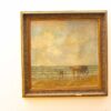 Tranquil beach scene with gentle waves and a solitary figure, capturing coastal beauty and simplicity.