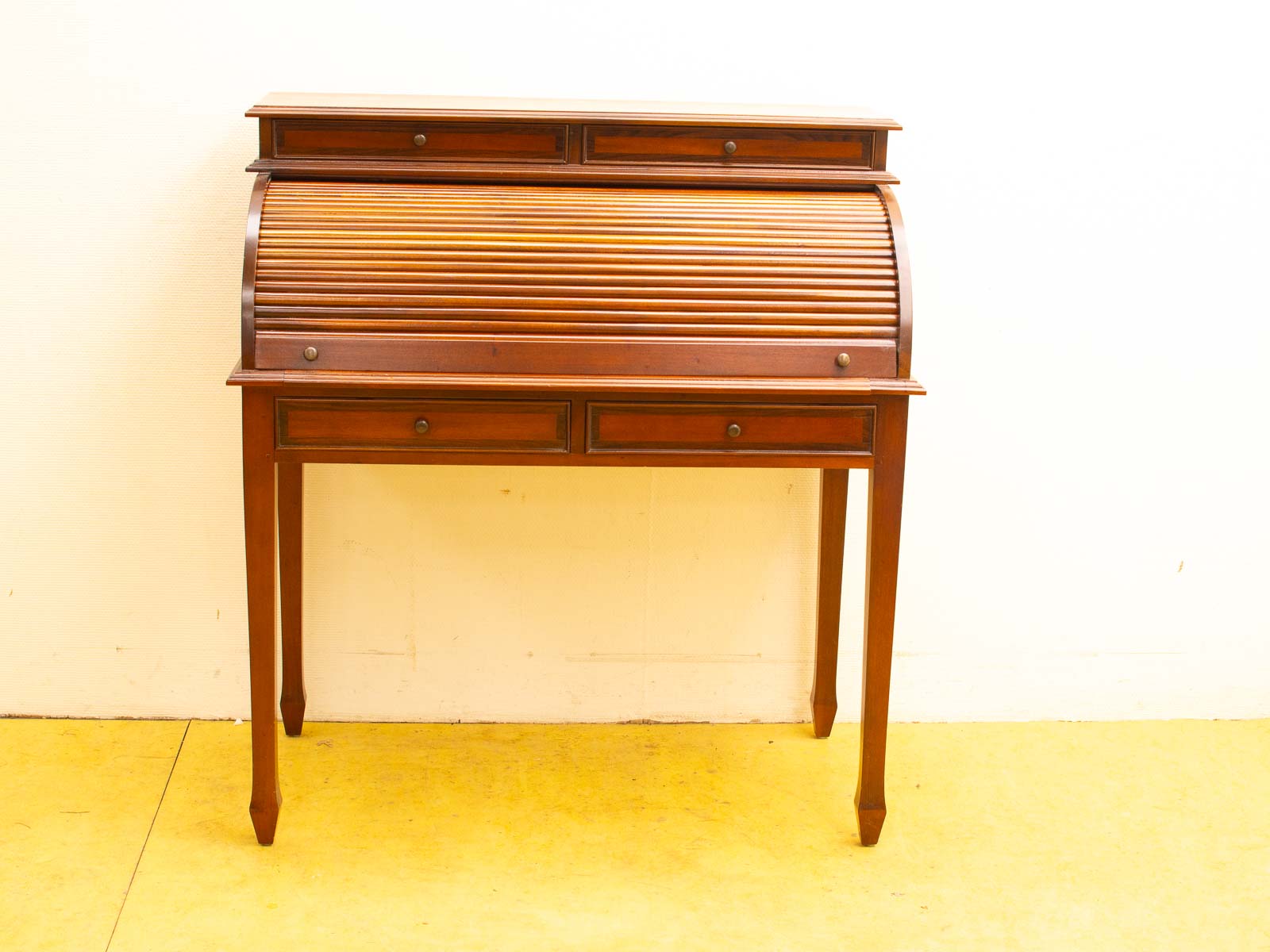 Elegant vintage roll-top desk in rich dark wood, perfect for stylish workspace organization.
