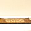 Elegant geometric vintage runner in gold and brown, showcasing intricate hexagonal designs.