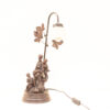 Vintage family lamp with bronze sculpture and frosted glass shade, perfect for warm lighting.
