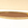 Elegant vintage serving tray in dark wood with gold-tone metal lattice for stylish entertaining.