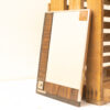 Rustic mirror with wood and metal frame, perfect for adding warmth to your interior decor.