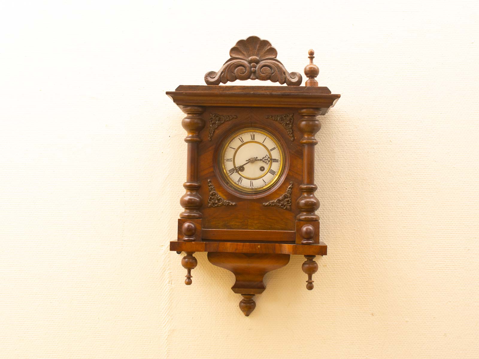 Handcrafted vintage wooden wall clock with Roman numerals, timeless design, and meticulous details.