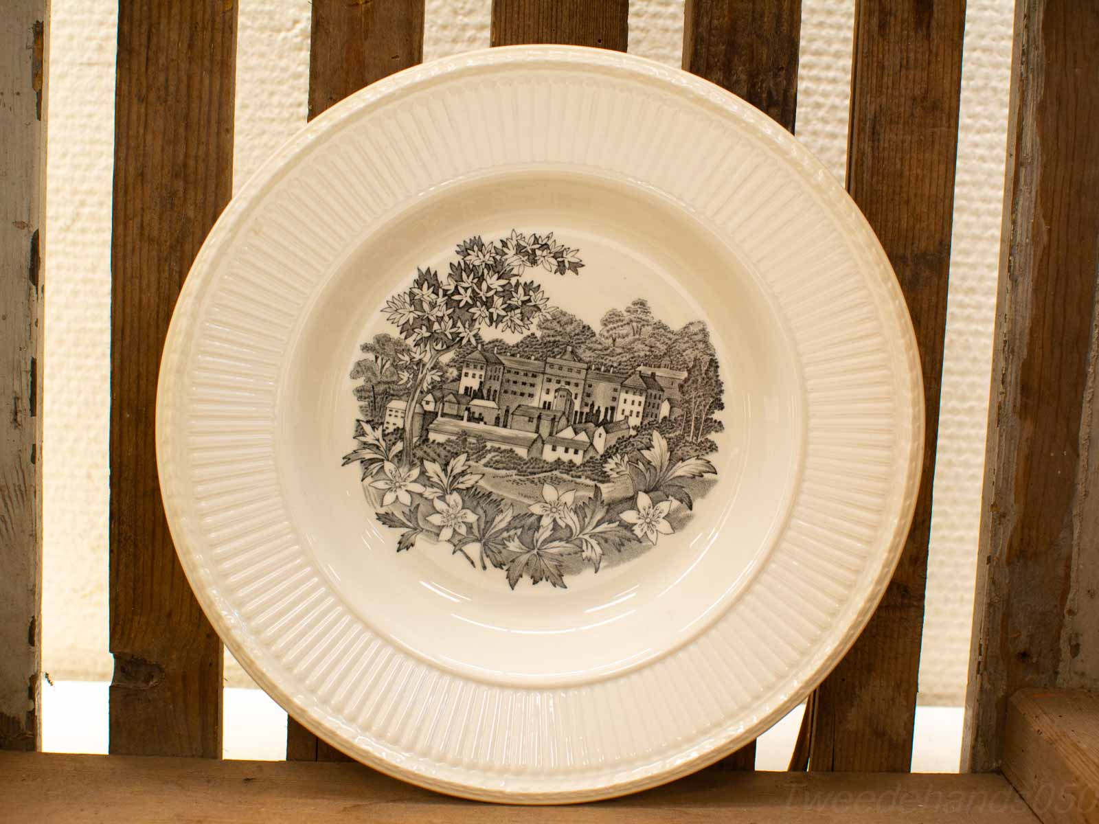 Vintage decorative plate with black-and-white landscape illustration, perfect for rustic home decor.