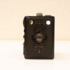 Vintage black box camera with flash and tripod mount, ideal for nostalgic photography experiences.