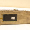 Handcrafted vintage music gadget with red buttons and textured surface for creative sound exploration.