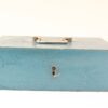 Vintage blue metal box with handle and keyhole, perfect for secure storage and decor.