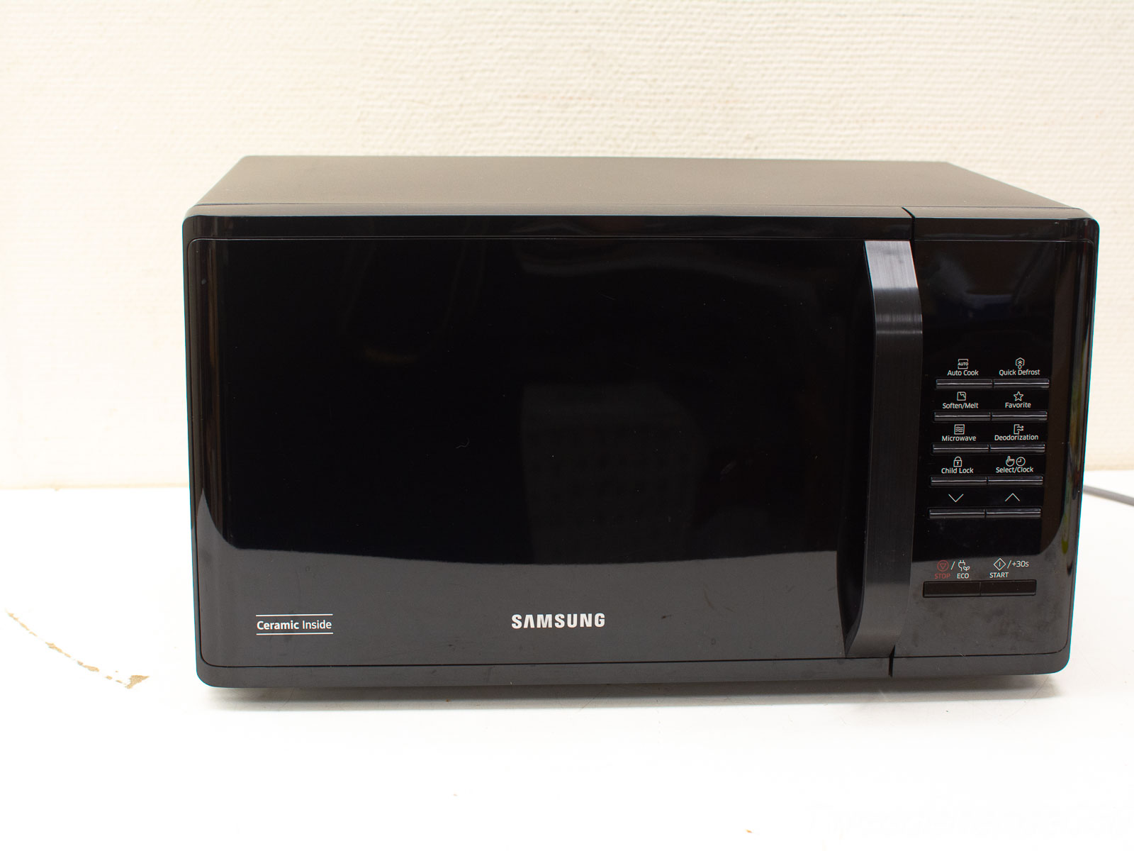 Sleek Samsung microwave with ceramic interior, modern design, and intuitive controls for effortless cooking.