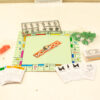Vintage Monopoly game with colorful properties, tokens, houses, hotels, and money for classic fun.