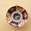 Stunning vintage ceramic plate with intricate blue and red floral designs, perfect for collectors.
