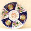 Vibrant, hand-painted ceramic plate showcasing traditional Asian floral patterns and craftsmanship.