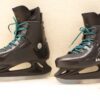 Zandstra ice skates in sleek black with vibrant turquoise laces and high-performance silver blades.