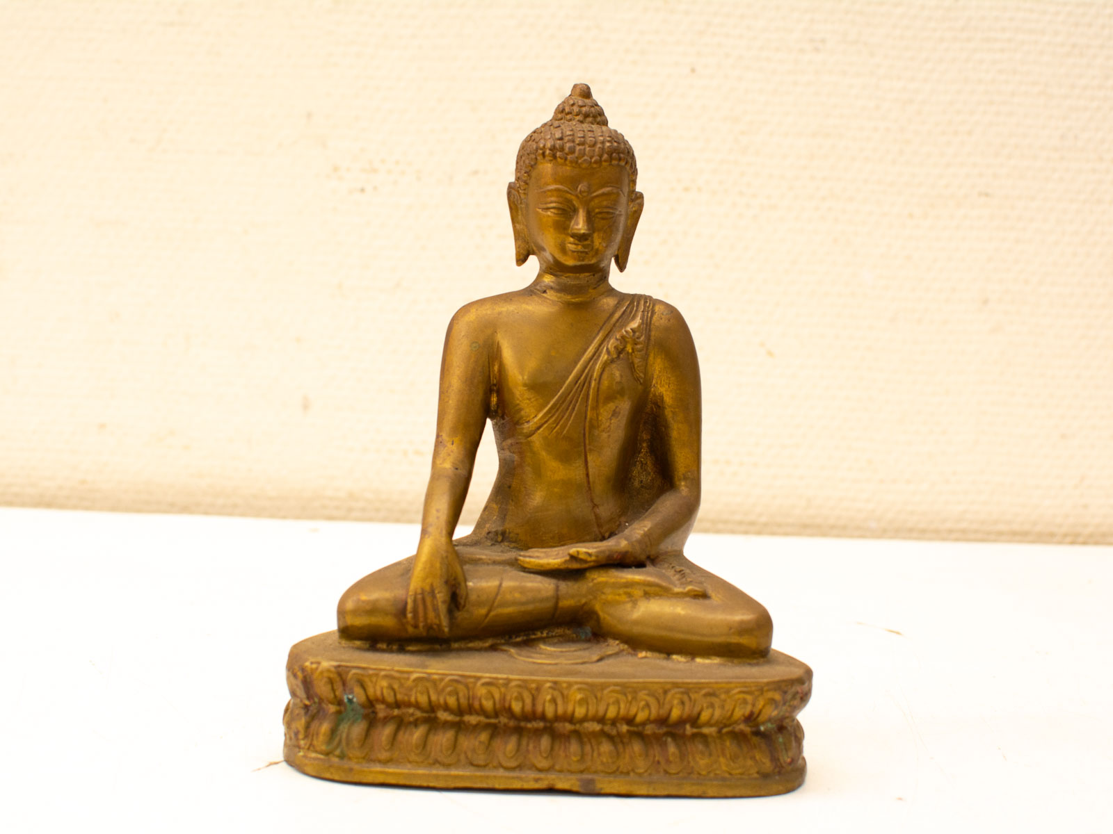 Intricate bronze seated Buddha statue, perfect for meditation and spiritual decor, radiates tranquility.