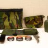 Military-themed accessories: camouflage pouches, cleaning supplies, and a water canteen for outdoor readiness.