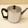 Elegant vintage stainless steel teapot, perfect for tea gatherings with a timeless charm.