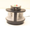 Sleek black and gray compact device with control panel and ventilation for home or office use.