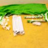 Vibrant green canopy with poles and connectors, perfect for outdoor shade and events.
