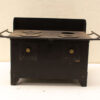 Classic vintage black stove with cast iron burners, showcasing nostalgia and durability for timeless kitchens.