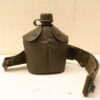 Durable green military canteen, ideal for outdoor adventures and rugged use. Perfect for explorers.