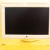 Sleek vintage Apple monitor with transparent design, rounded legs, perfect for creative workspaces.