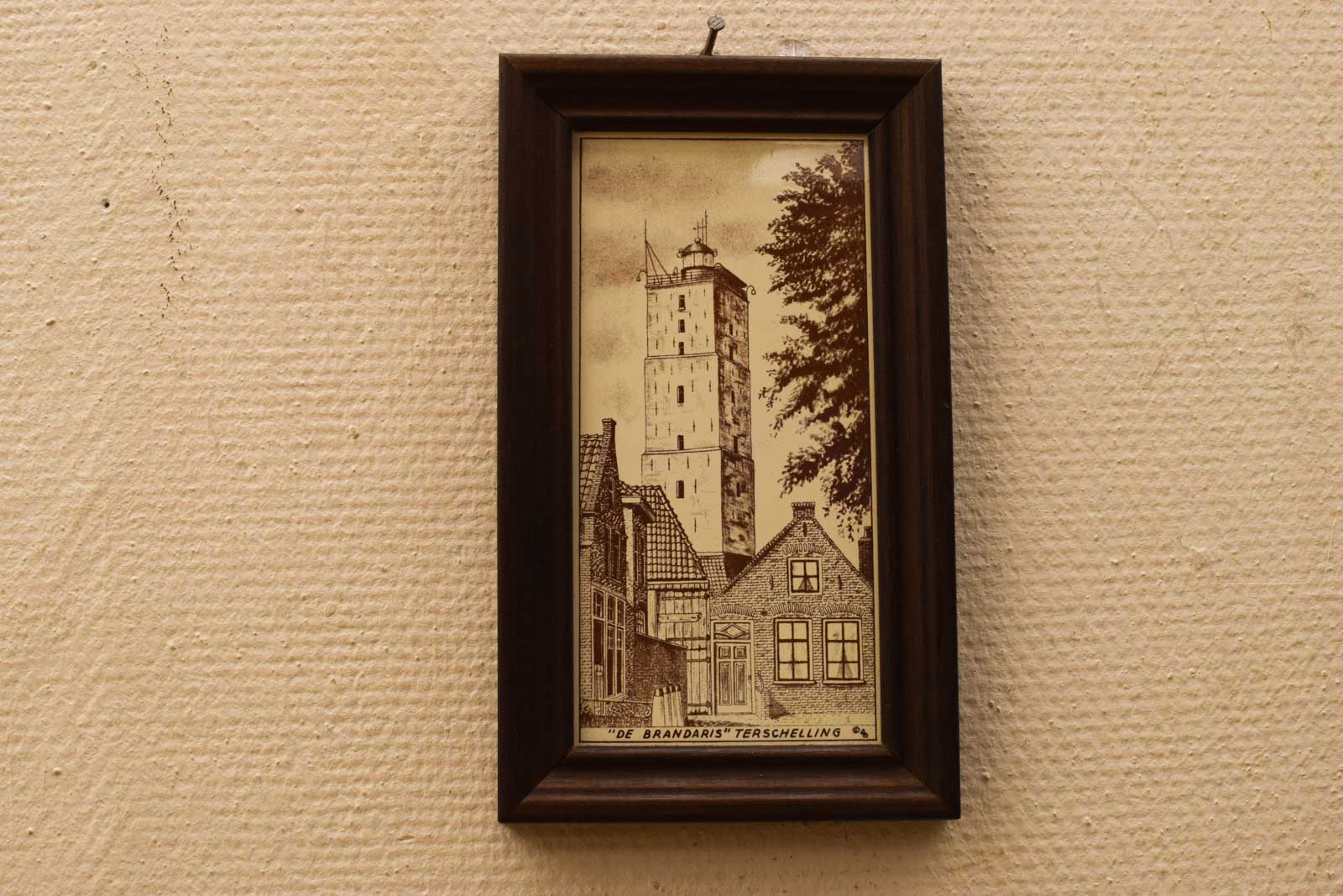 Wandtegel in een houten lijstje  45347