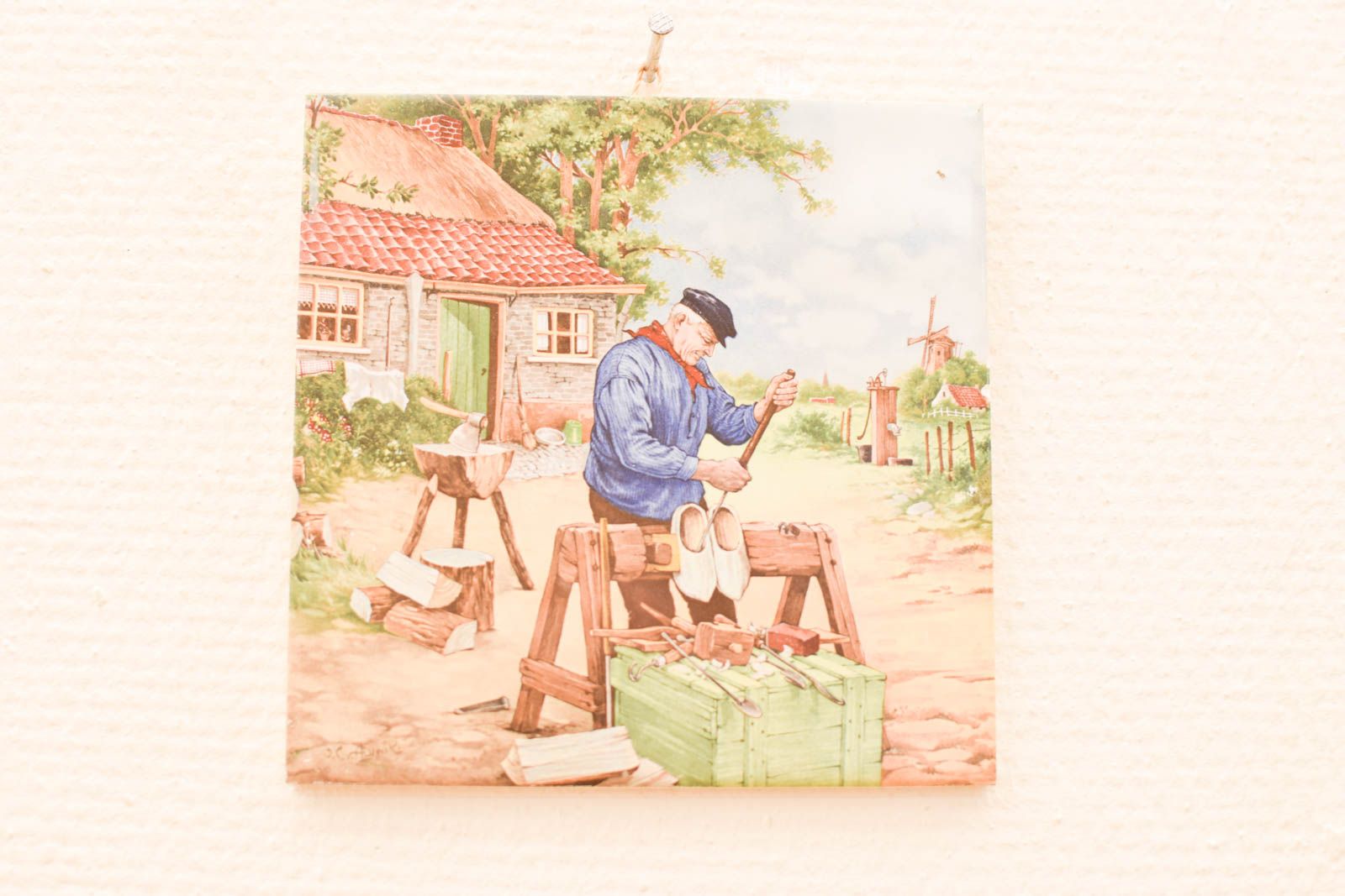 Wandtegel met prent  van een schoenmaker  46129